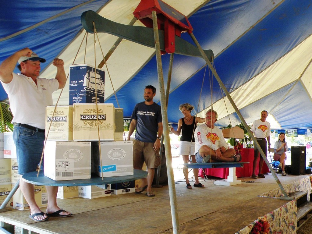 Chris Thompson has crewman Frank Barns sit in at the weighing for the rum - 16th Annual St. Croix International Regatta © Ellen Sanpere